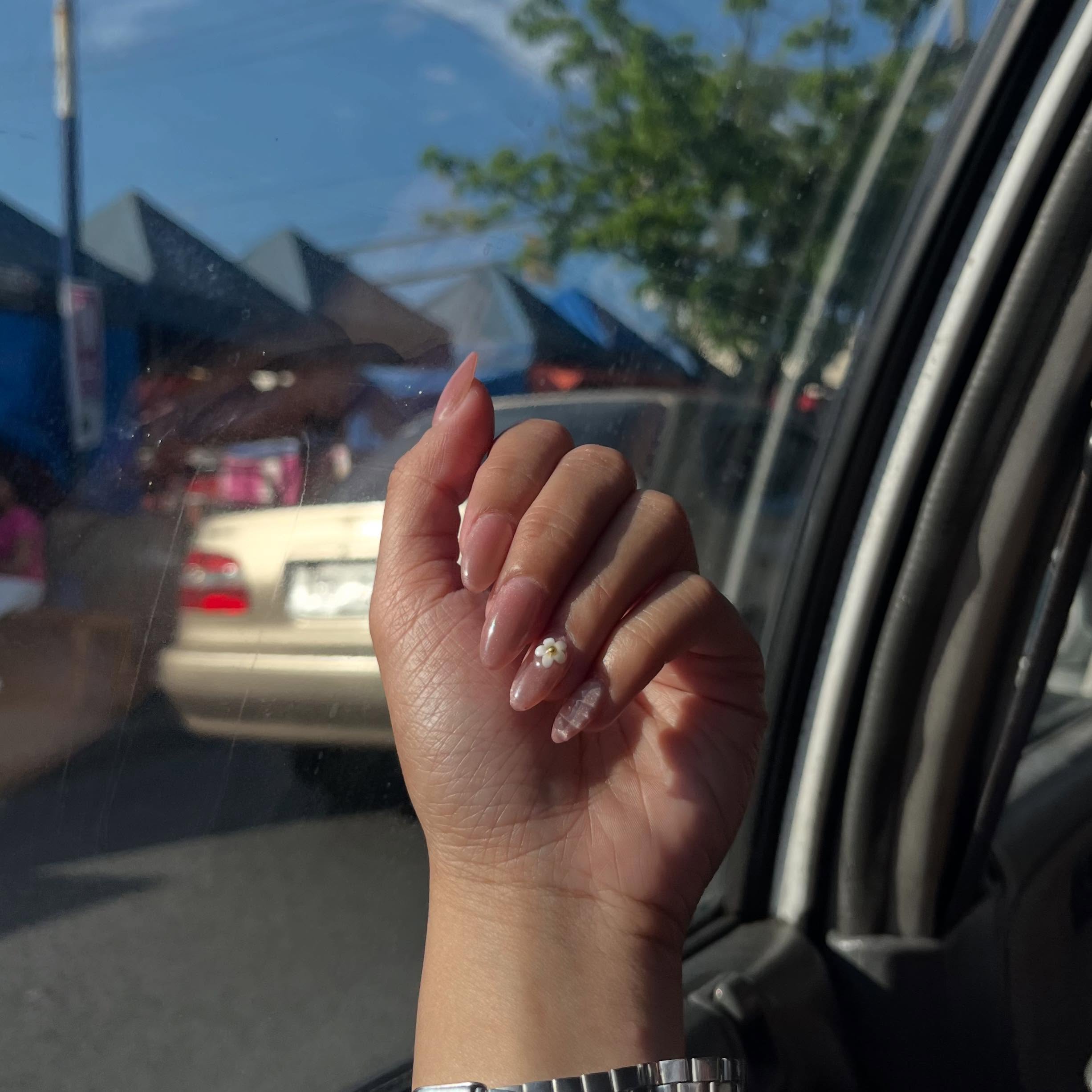 Milky nails with a flower accent
